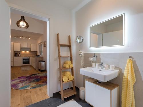 a bathroom with a sink and a mirror at Going EASY in Going