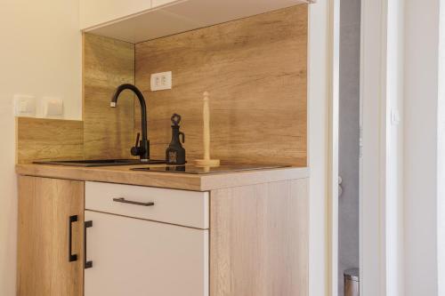 a kitchen with a sink and a counter at Apartments Piritus in Split