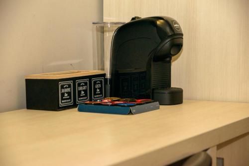 a toaster sitting on a counter next to a box at Hotel Anna Siena Nord in Siena