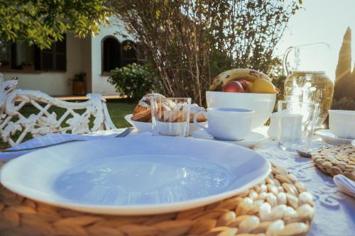 a table with a plate of food on top of it at Labella Villa in Viterbo