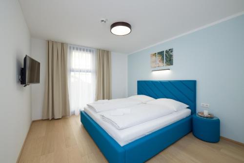 Postel nebo postele na pokoji v ubytování Yourapartment Theresien