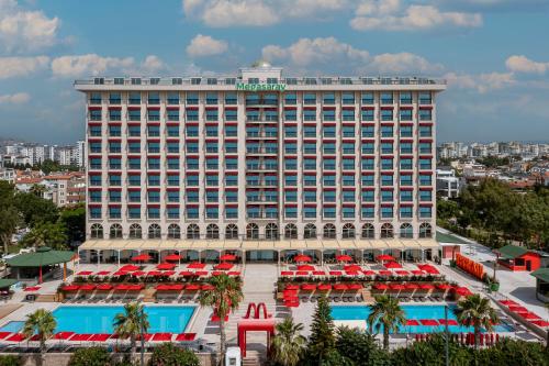 a hotel with a large building with a pool at Megasaray Westbeach Antalya - Ultra All Inclusive in Antalya