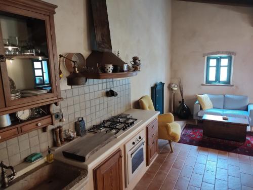 a kitchen with a sink and a stove top oven at Apartment Nona Keka in Cres
