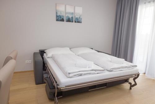 Postel nebo postele na pokoji v ubytování Yourapartment Theresien