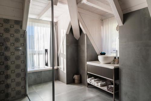 a bathroom with a sink and a window at LUXURY SUITES ROCOPOM - Lake Front in Lecco