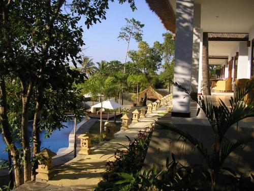 a view of a house with a pool of water at Imaj Private Villas in Senggigi 