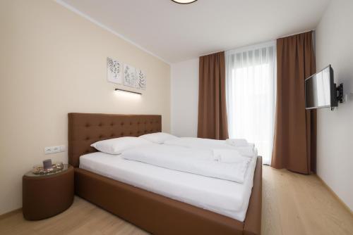 Postel nebo postele na pokoji v ubytování Yourapartment Theresien