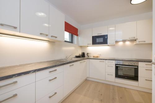 Kuchyň nebo kuchyňský kout v ubytování Yourapartment Theresien