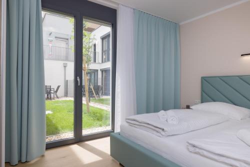 Postel nebo postele na pokoji v ubytování Yourapartment Theresien