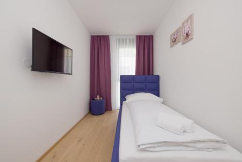 Postel nebo postele na pokoji v ubytování Yourapartment Theresien