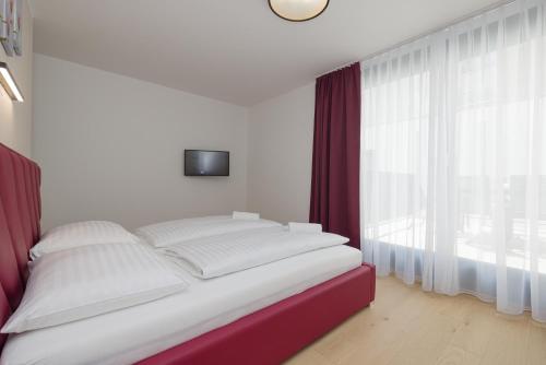 Postel nebo postele na pokoji v ubytování Yourapartment Theresien