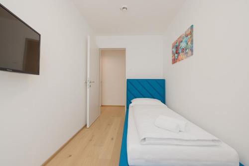Postel nebo postele na pokoji v ubytování Yourapartment Theresien