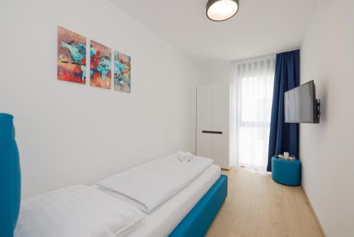 Postel nebo postele na pokoji v ubytování Yourapartment Theresien