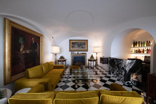 a living room with a couch and a table at Palazzo Don Salvatore in Amalfi