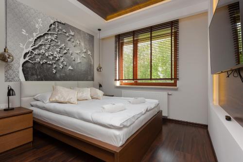 Posteľ alebo postele v izbe v ubytovaní Apartment Warsaw Airport Kłobucka by Noclegi Renters