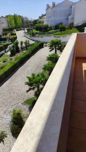 a view from the roof of a building with palm trees at Authentic Charm Soltroia in Troia
