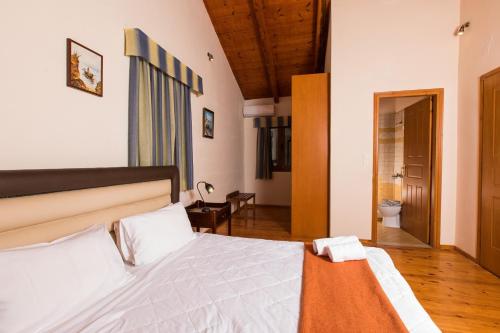 Ένα ή περισσότερα κρεβάτια σε δωμάτιο στο Cretan Exclusive Villas