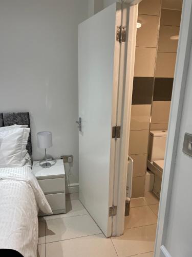 a bedroom with a bed and a closet at Lovely holiday home in Southminster in Southminster