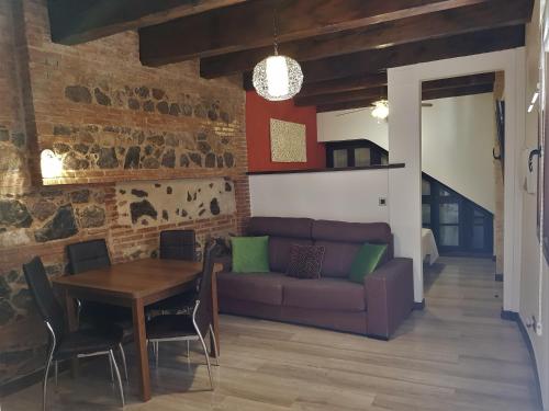 Posedenie v ubytovaní Apartamentos Alcantara