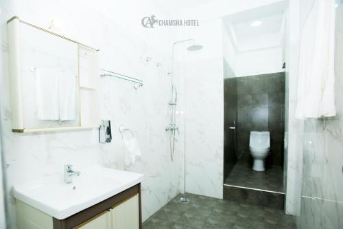Koupelna v ubytování Chamsha Hotel