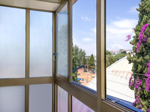 a room with windows and a view of a stadium at Panorama Love to Stay in Ercolano