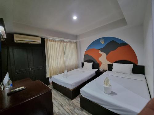 Kama o mga kama sa kuwarto sa Sun Moon Hotel