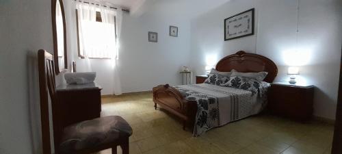 A bed or beds in a room at La puerta el sol