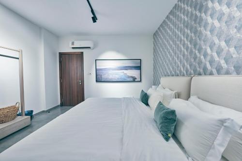 Llit o llits en una habitació de Mabaat - Al Shurooq 10 - 90