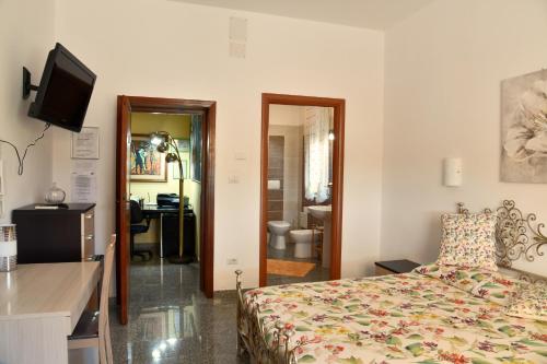 Ένα ή περισσότερα κρεβάτια σε δωμάτιο στο Il Sole Guesthouse