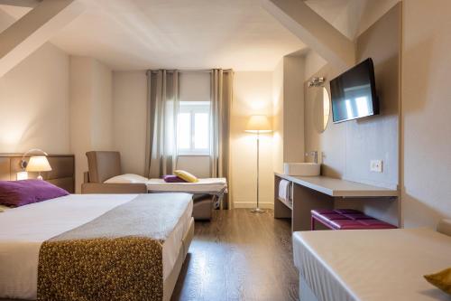 Postel nebo postele na pokoji v ubytování Hotel Alexandra