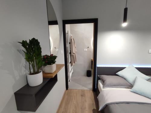 Postel nebo postele na pokoji v ubytování Boutique rooms by Petrič winery