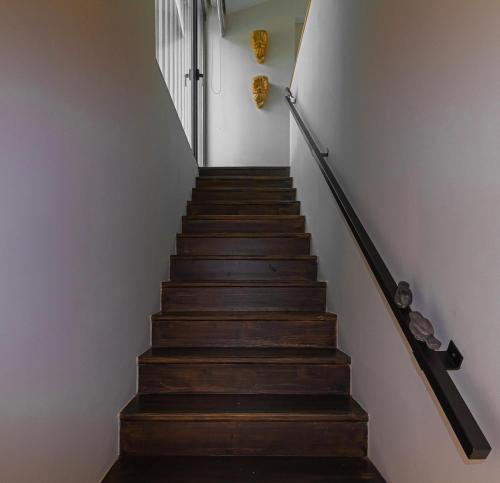 a staircase leading up to the second floor of a house at Villa Cerrado das Fontainhas SPA in Sintra