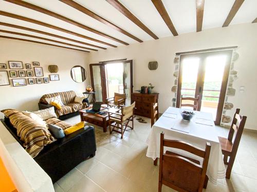 a living room with a couch and a table at Cinnamon House in Kritsa in Kritsá