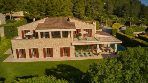 an aerial view of a house with a roof at Villa Ruby by Cap Vermell Estate in Canyamel