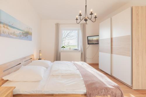 Postel nebo postele na pokoji v ubytování Grenzhaus am See