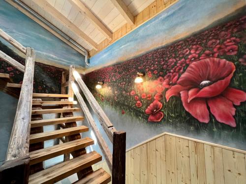 a mural of a room with a staircase and flowers at Vila Liberta in Poprad