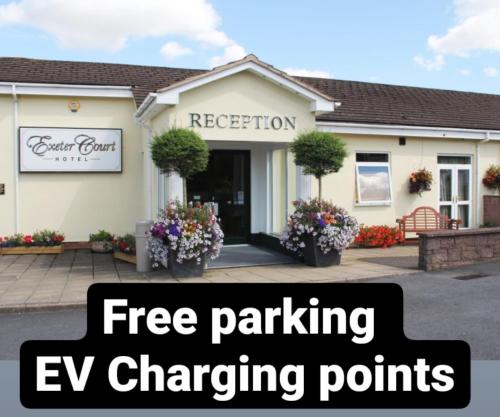 a house with the words free parking ev charging points at Exeter Court Hotel in Exeter