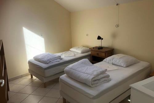 Cama o camas de una habitación en Maison Place manemeur