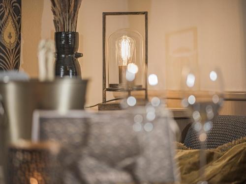 a table with a mirror and a vase on it at Hotel Post in Kaltenbach