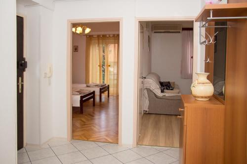 a living room with a couch and a table at Apartment Leatoni in Split