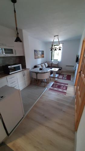 a living room with a couch and a table at Apartments Durmitor in Žabljak
