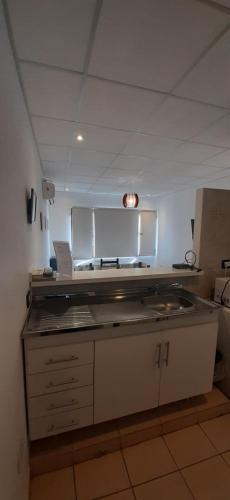 Η κουζίνα ή μικρή κουζίνα στο Departamentos Saavedra dtos 1y2