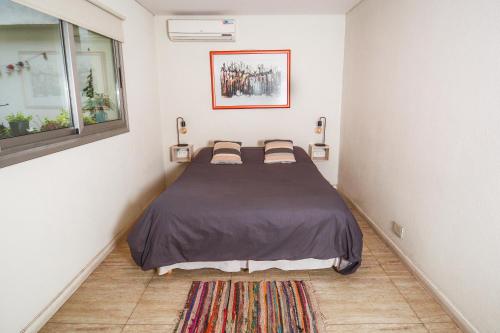 A bed or beds in a room at Jaque Mate Hostel