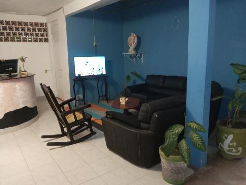 TV a/nebo společenská místnost v ubytování Hotel Lu'um