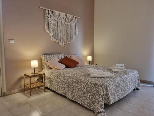 Кровать или кровати в номере Etna Ocean Rooms