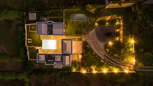 an overhead view of a building with street lights at night at Au Temps D'antan- Ile Rodrigues in Rodrigues Island