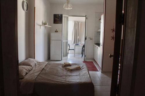 Ένα ή περισσότερα κρεβάτια σε δωμάτιο στο Baia Verde Casa di Fatima