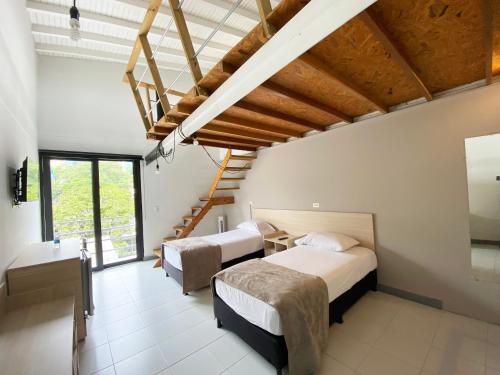Voodi või voodid majutusasutuse Ayenda 1224 Pixel House toas