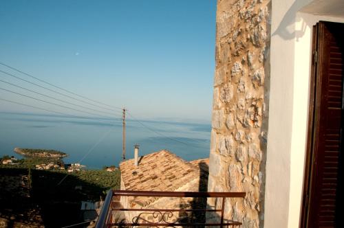 a view of the ocean from a balcony of a building at Pyrgos Fassea Kardamyli Towerhouse in Kardamili