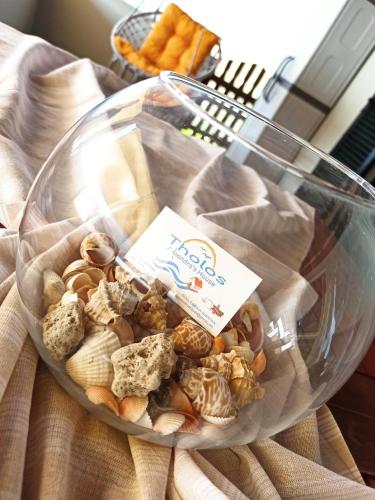 a bowl of cookies and crackers on a table at Tholos Alexandra's Beachfront House in Kavoúsion